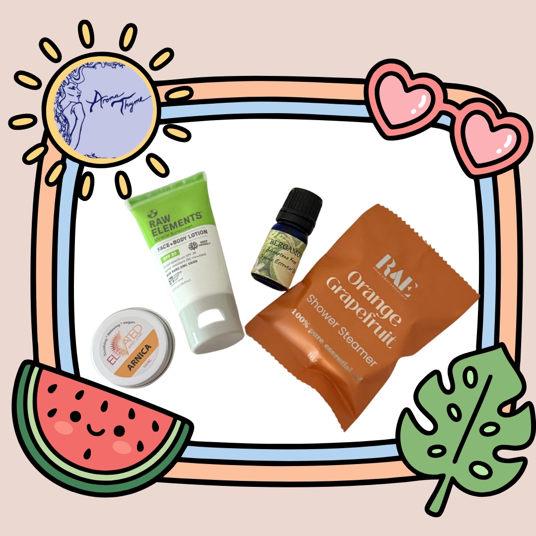 A curated collection of wellness and skincare products arranged on a white background with a decorative illustrated border. The products include a green and white tube labeled Raw Elements SPF 30 face and body lotion,a small amber bottle with a black cap, a round white tin labeled 'Arnica , and an orange packet labeled 'RAE Orange Grapefruit Shower Steamers'.