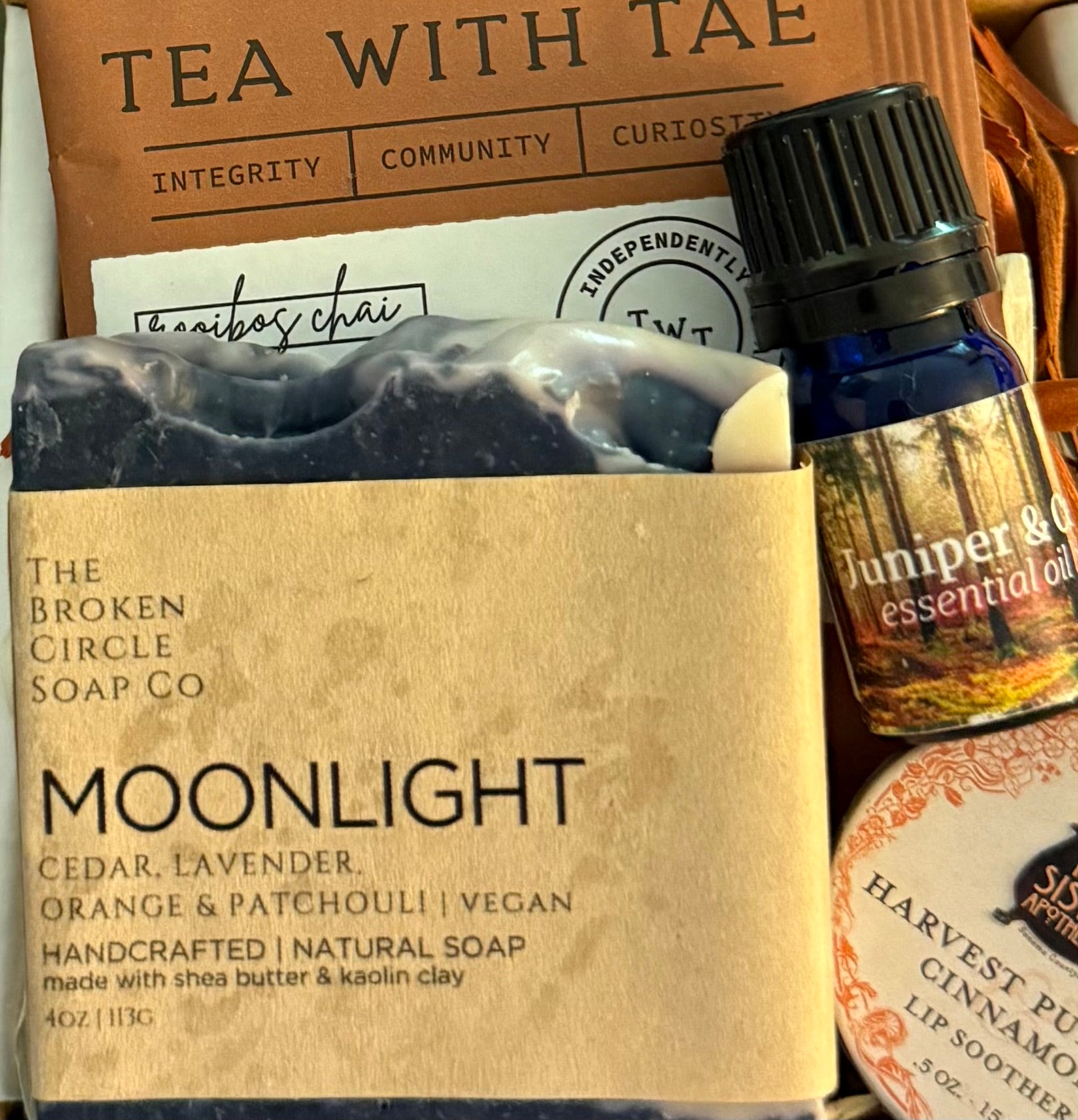 Moonlight soap bar from The Broken Circle Soap Co with Juniper & Cedar  essential oil bottle in the background.